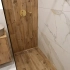 Душевая зона с односкатным уклоном и линейным трапом